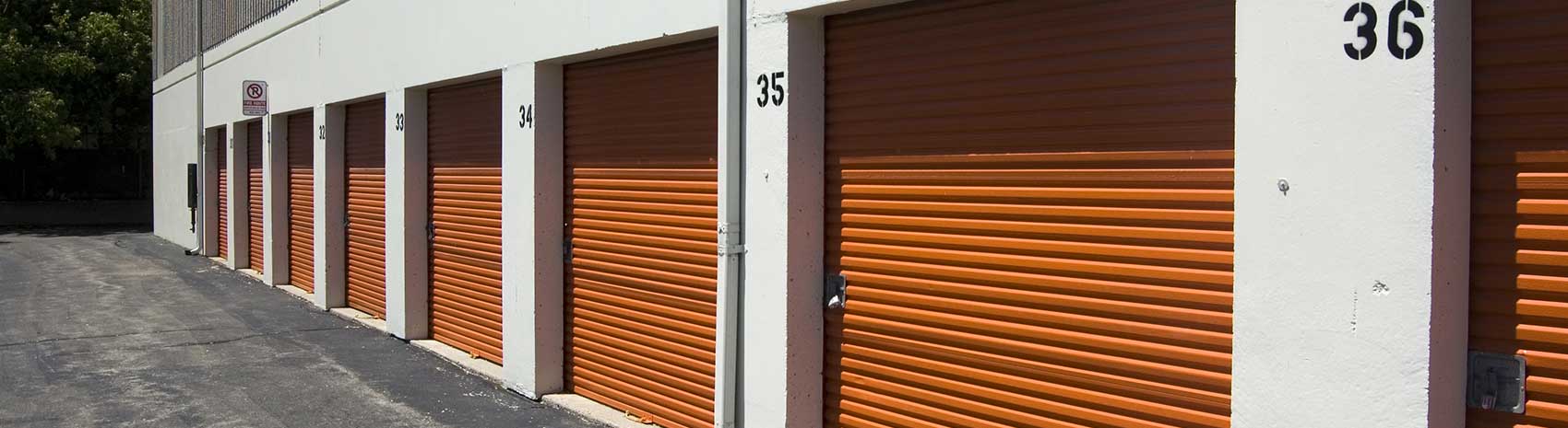 Commercial garage doors for facilities such as storage units