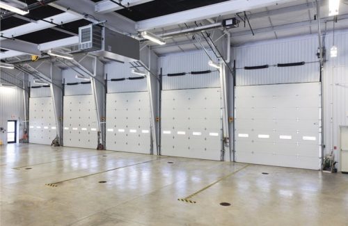 Row of white commercial garage doors