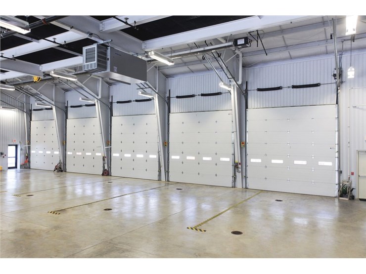 Row of white commercial garage doors