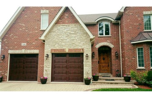 home with new wooden garage doors