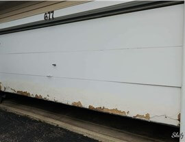 white garage door with chipped paint